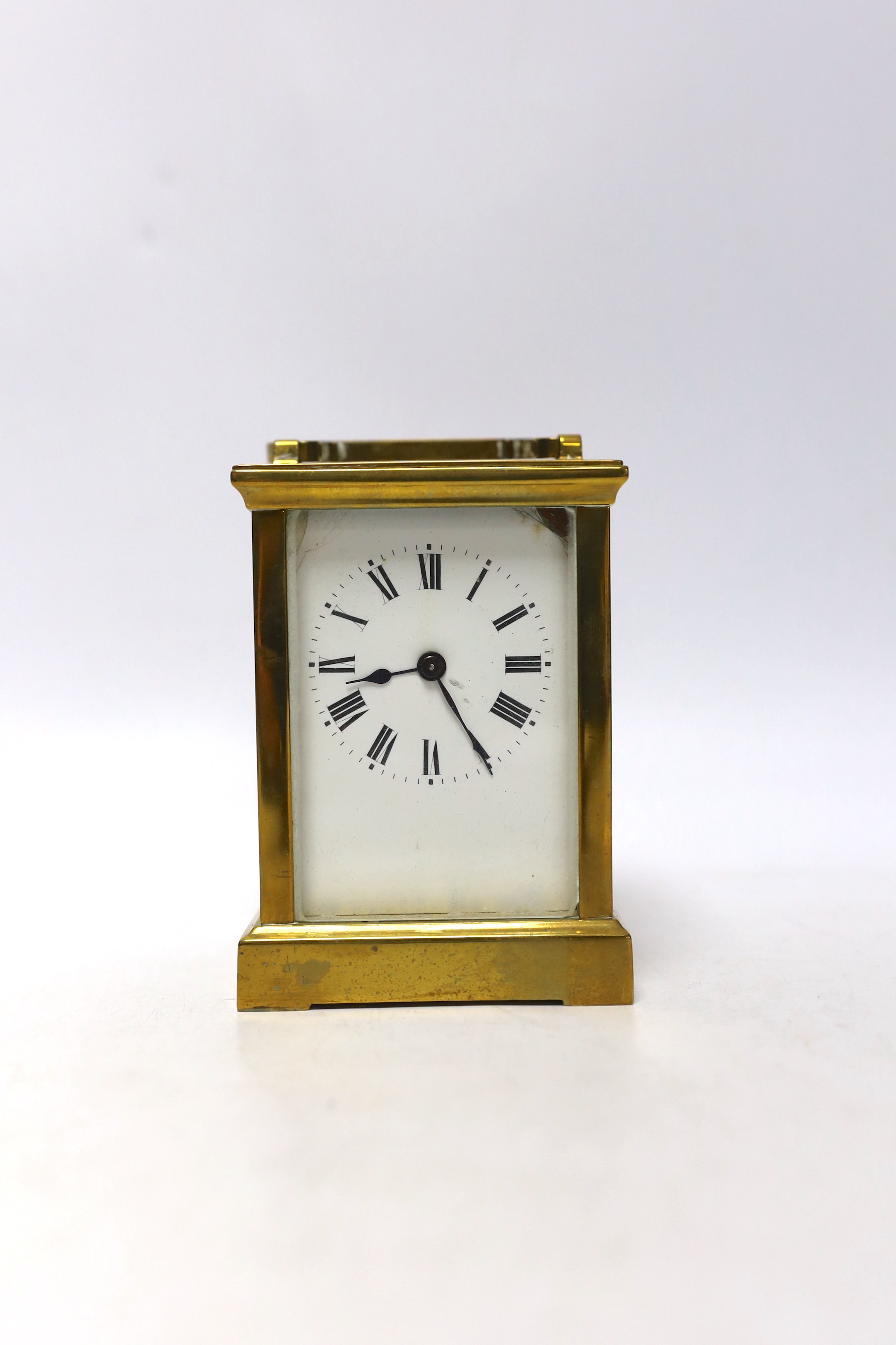 A cased brass carriage timepiece, 14cm high
